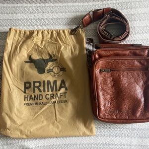 100% leather small messenger bag.Engraved Isaiah 41:13 perfect condition